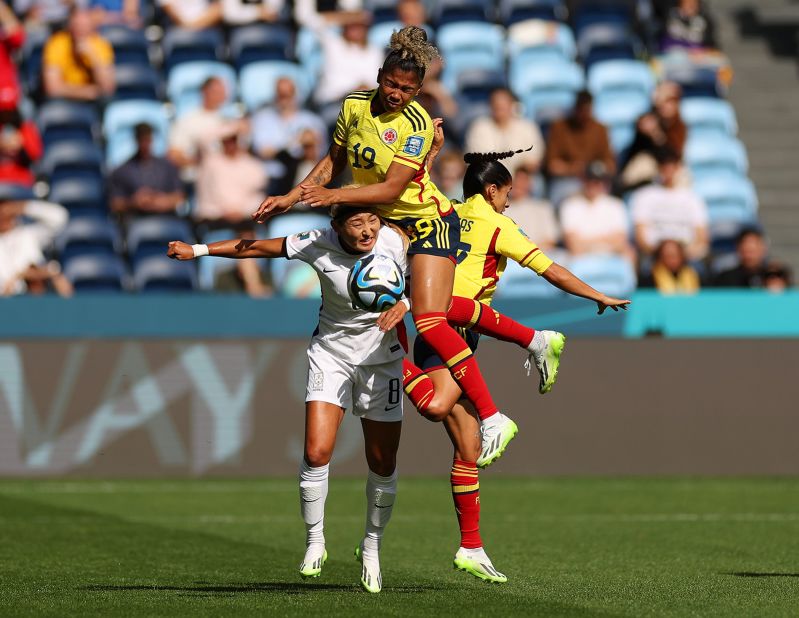 South Korea's Cho So-hyun, bottom left, competes for the ball against Colombia's Jorelyn Carabali and Carolina Arias.