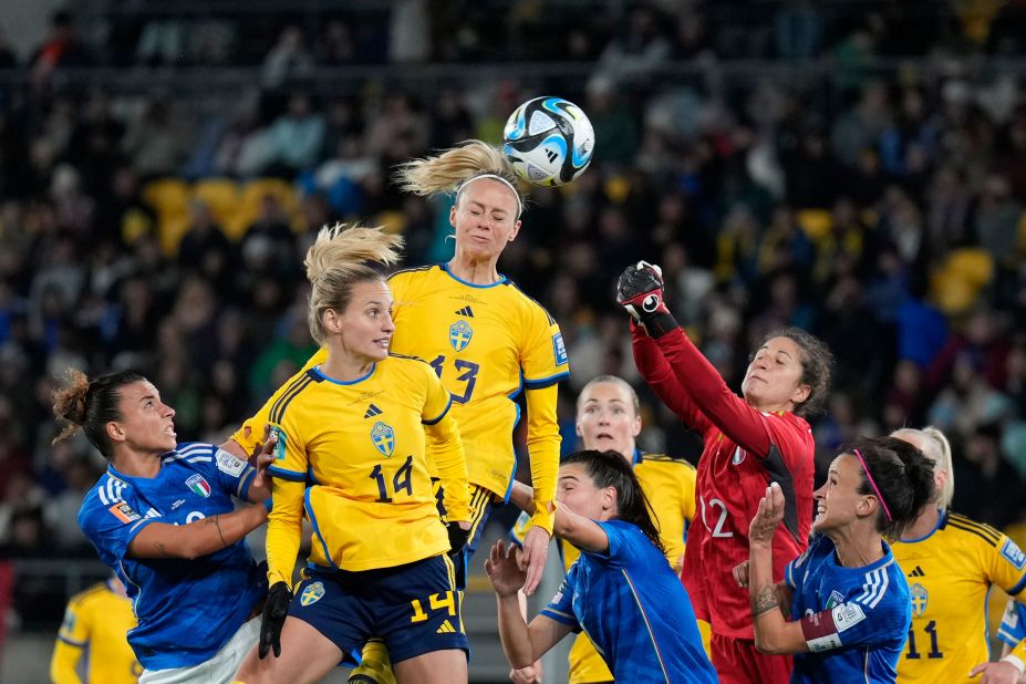 Sweden's Amanda Ilestedt, center, heads the ball to score the opening goal against Italy on July 29. Sweden won 5-0.