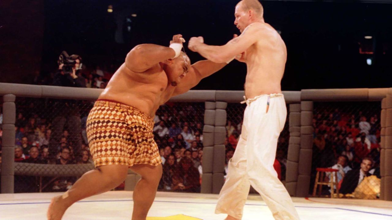 Martial artist Gerard Gordeau of Amsterdam, Holland lands a left to the head of Sumo wrestler Teilo Tuli of Honolulu, HA is during the Ultimate Fighter Championships in Denver, Colorado. Gordeau went on to win the match and eventually advance to the final.