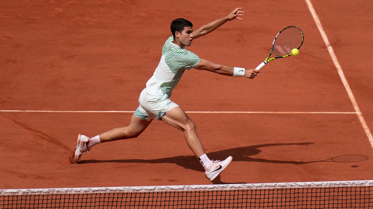 Jun 9 2023; Paris,France; Carlos Alcaraz (ESP) returns a shot during his semifinal match against Novak Djokovic (SRB) on day 13 at Stade Roland-Garros.