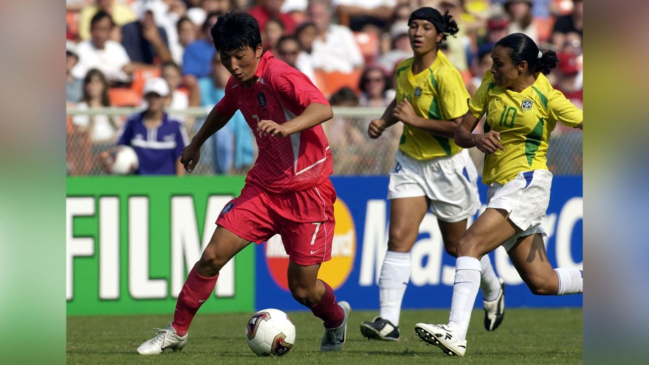 Korea Republic forward Eun Sun Park drives around Brazil forward Marta Sunday.  Brazil  defeated  the Korea Republic  3 - 0 in the opening round of the FIFA Women's 2003 World Cup