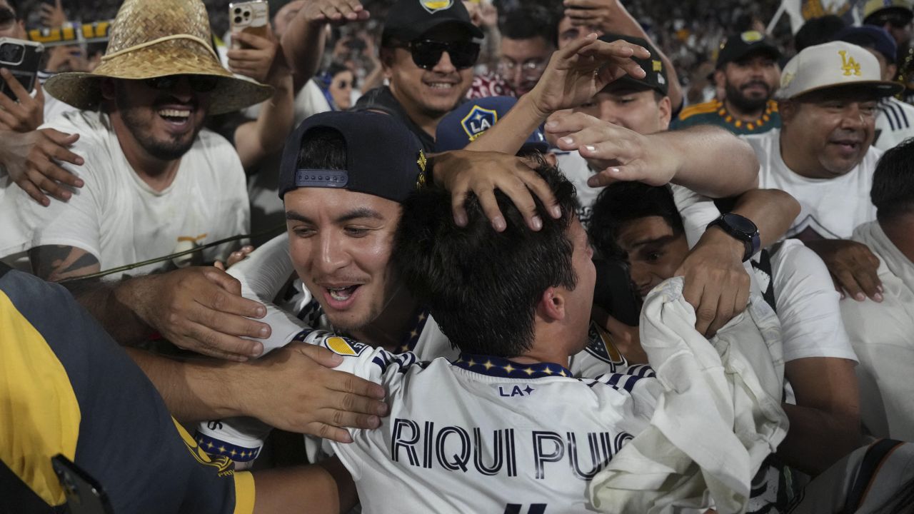 Jul 4, 2023; Los Angeles, California, USA; LA Galaxy midfielder Riqui Puig (6) celebrates with fans after the game against the LAFC at the Rose Bowl. Mandatory Credit: Kirby Lee-USA TODAY Sports