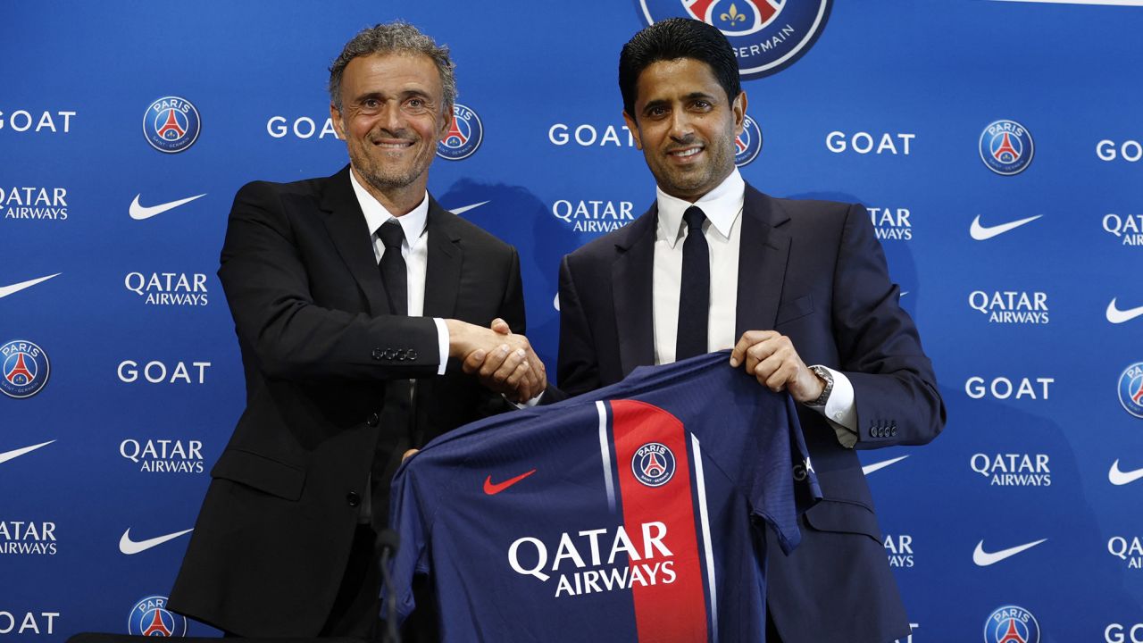 Soccer Football - Paris St Germain  - Paris St Germain unveil new coach Luis Enrique - Paris-Saint-Germain Training Centre, Poissy, France - July 5, 2023 
Paris St Germain president Nasser Al-Khelaifi and new coach Luis Enrique pose with a club shirt during the press conference REUTERS/Gonzalo Fuentes