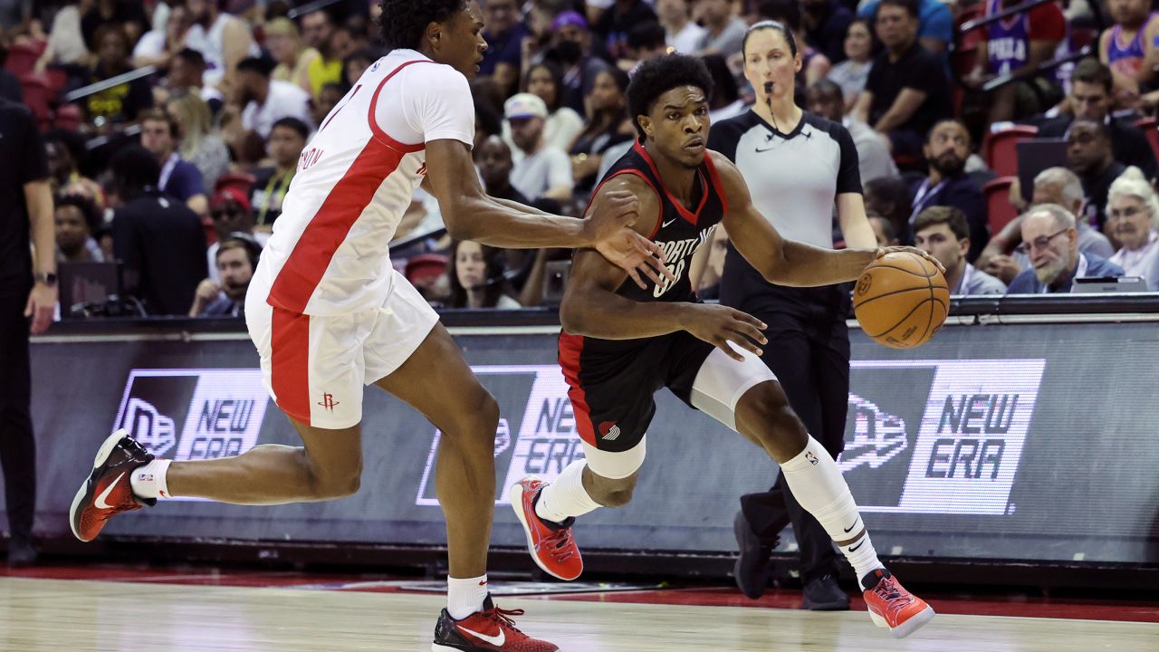 Scoot Henderson #00 of the Portland Trail Blazers dribbles the ball against Amen Thompson #1 of the Houston Rockets during the third quarter at the Thomas & Mack Center on July 07, 2023 in Las Vegas, Nevada.