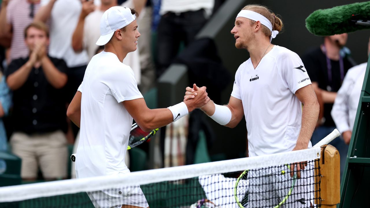 Holger Rune of Denmark interacts with defeated Alejandro Davidovich Fokina of Spain at the net after their Men's Singles third round match during day six of The Championships Wimbledon 2023 at All England Lawn Tennis and Croquet Club on July 08, 2023 in London, England.