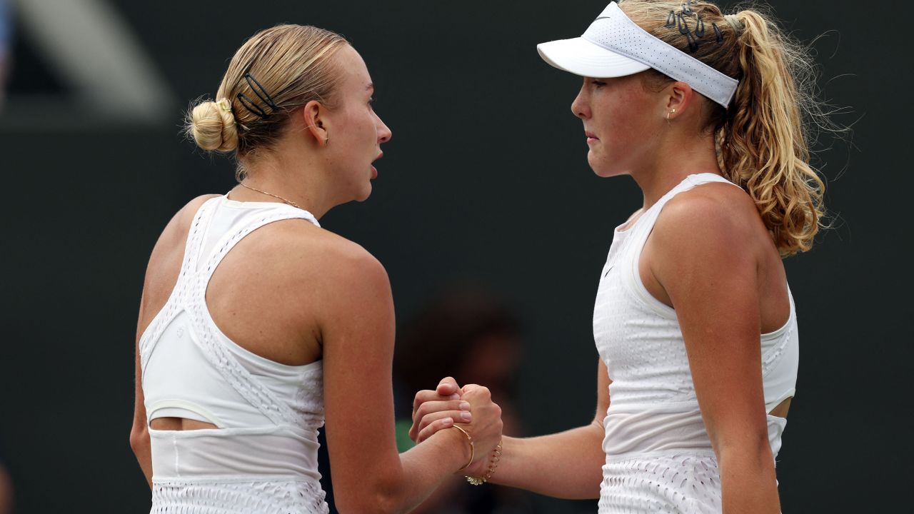 Russia's Mirra Andreeva (R)shakes hands with Russia's Anastasia Potapova after winning their women's singles tennis match on the seventh day of the 2023 Wimbledon Championships at The All England Tennis Club in Wimbledon, southwest London, on July 9, 2023.