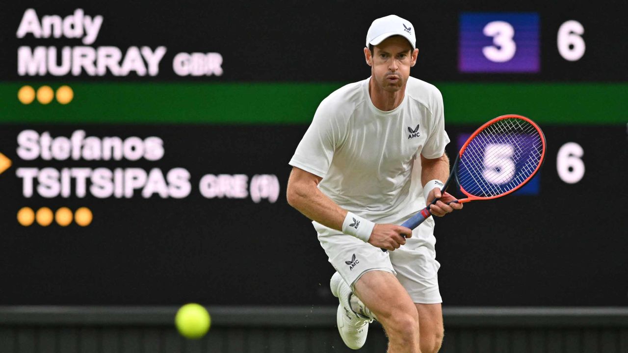 Britain's Andy Murray runs to play a return against Greece's Stefanos Tsitsipas during their men's singles tennis match on the fourth day of the 2023 Wimbledon Championships at The All England Tennis Club in Wimbledon, southwest London, on July 6, 2023. (Photo by Glyn KIRK / AFP) / RESTRICTED TO EDITORIAL USE (Photo by GLYN KIRK/AFP via Getty Images)