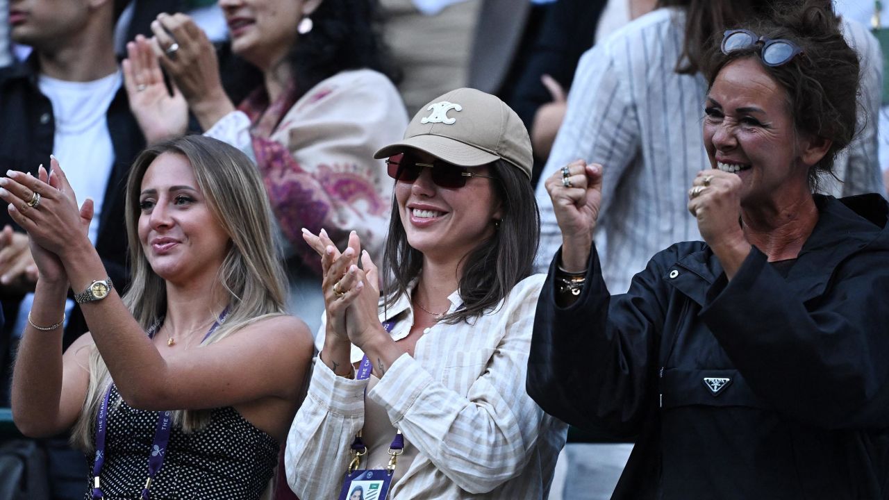 Tennis - Wimbledon - All England Lawn Tennis and Croquet Club, London, Britain - July 10, 2023
Aneke Rune, mother of Denmark's Holger Rune and Caroline Donzella celebrate after he won his fourth round match against Bulgaria's Grigor Dimitrov REUTERS/Dylan Martinez