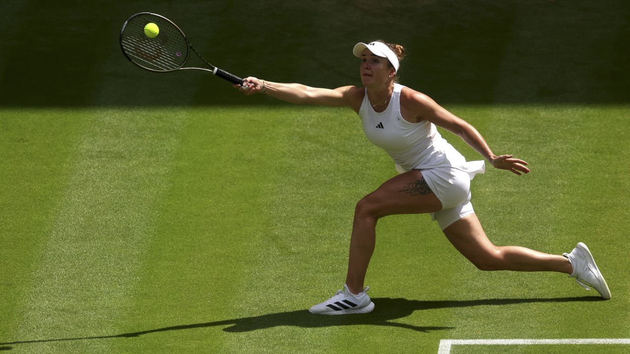 LONDON, ENGLAND - JULY 11: Elina Svitolina of Ukraine plays a forehand against Iga Swiatek of Poland in the Women's Singles Quarter Final match during day nine of The Championships Wimbledon 2023 at All England Lawn Tennis and Croquet Club on July 11, 2023 in London, England. (Photo by Julian Finney/Getty Images)