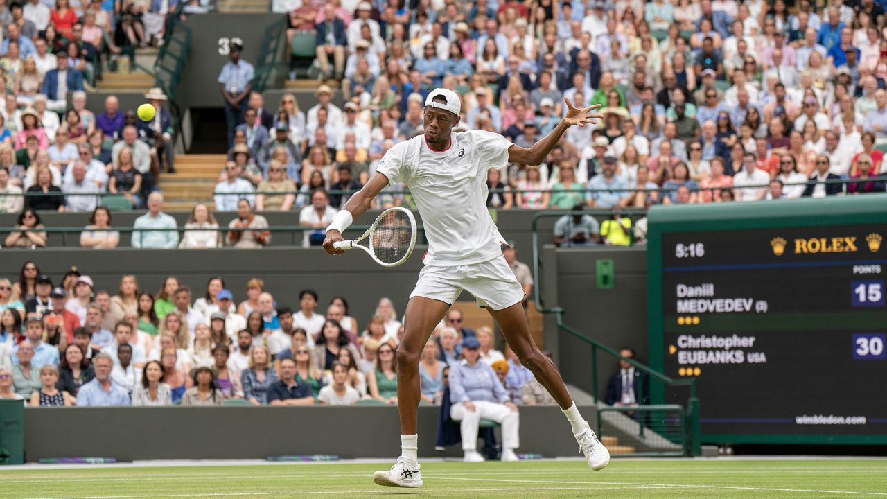 Jul 12, 2023; London, United Kingdom; Christopher Eubanks (USA) returns a shot during his match against Daniil Medvedev on day ten of Wimbledon at the All England Lawn Tennis and Croquet Club.  Mandatory Credit: Susan Mullane-USA TODAY Sports