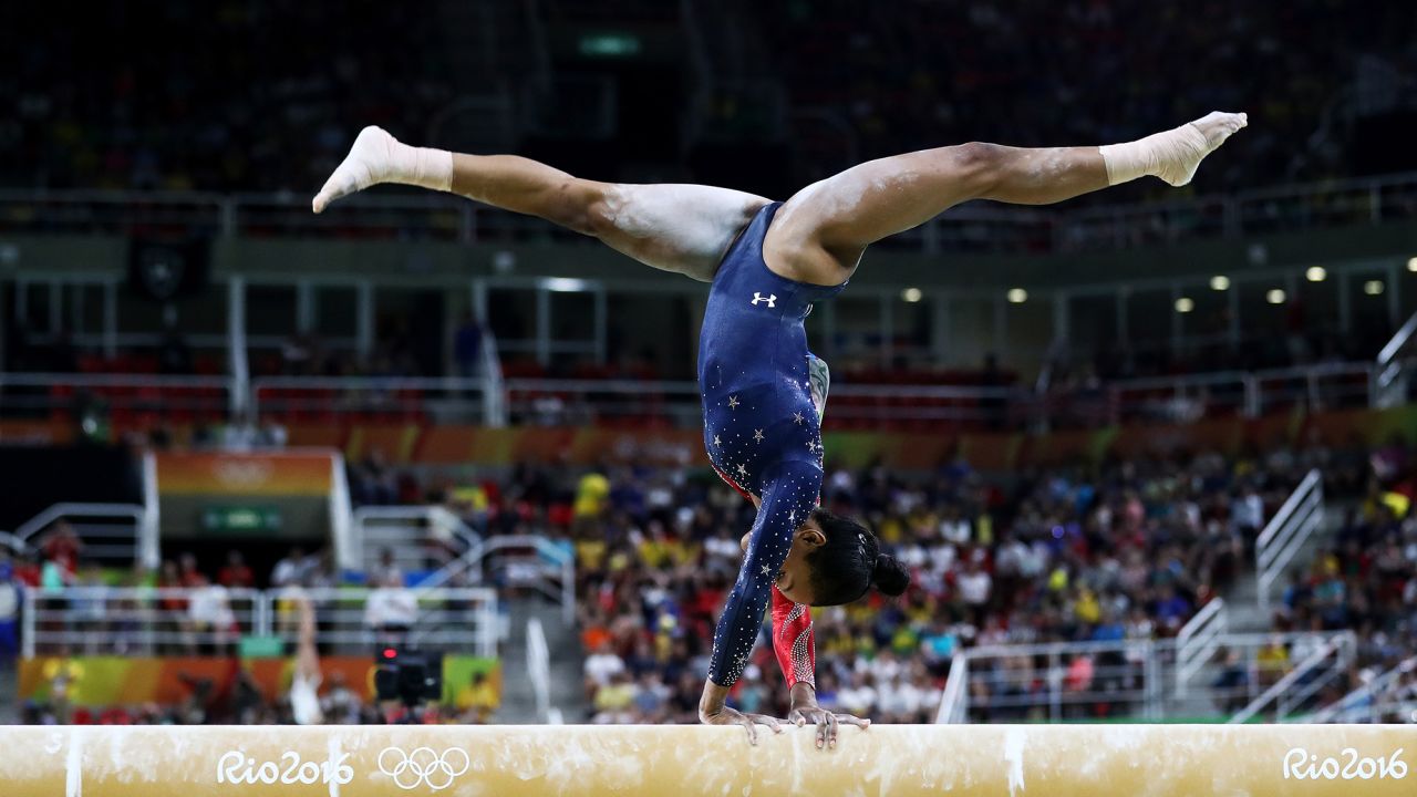 RIO DE JANEIRO, BRAZIL - AUGUST 07:  Gabrielle Douglas of the United States competes on the balance beam during Women's qualification for Artistic Gymnastics on Day 2 of the Rio 2016 Olympic Games at the Rio Olympic Arena on August 7, 2016 in Rio de Janeiro, Brazil  (Photo by Ezra Shaw/Getty Images)