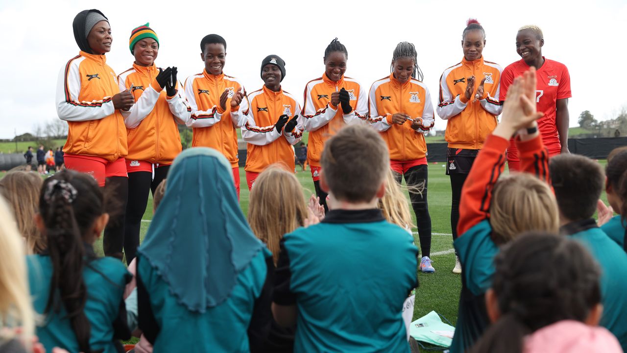 HAMILTON, NEW ZEALAND - JULY 17: Players of Zambia speak with local children during a Zambia Training Session on July 17, 2023 in Hamilton, New Zealand. (Photo by Michael Bradley - FIFA/FIFA via Getty Images)