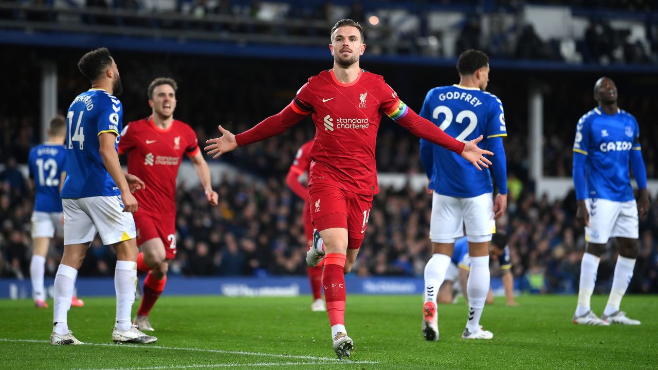 Jordan Henderson of Liverpool celebrates after scoring their side's first goal during the Premier League match between Everton and Liverpool at Goodison Park on December 01, 2021 in Liverpool, England.