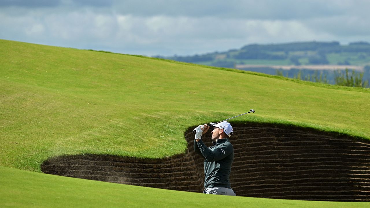 TOPSHOT - England's Oliver Wilson plays out of a bunker on the 17th hole during a practice round for 151st British Open Golf Championship at Royal Liverpool Golf Course in Hoylake, north west England on July 19, 2023. The Royal Liverpool Golf Course will host The 151st Open from July 20 to 23, 2023. (Photo by Glyn KIRK / AFP) / EDITORIAL USE ONLY (Photo by GLYN KIRK/AFP via Getty Images)