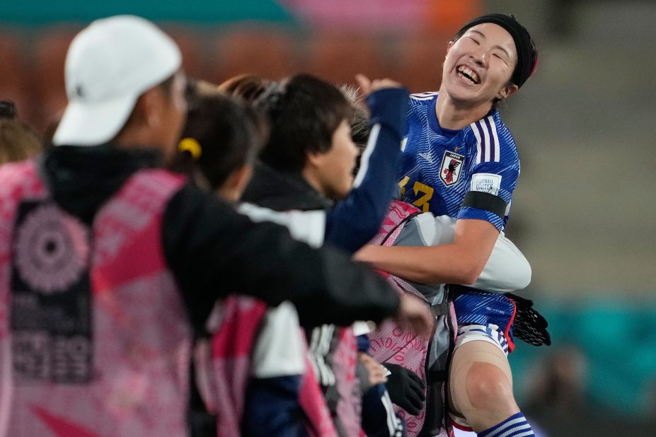 Japan's Jun Endo celebrates with her bench after scoring her team's fourth goal in a 5-0 win against Zambia on July 22.