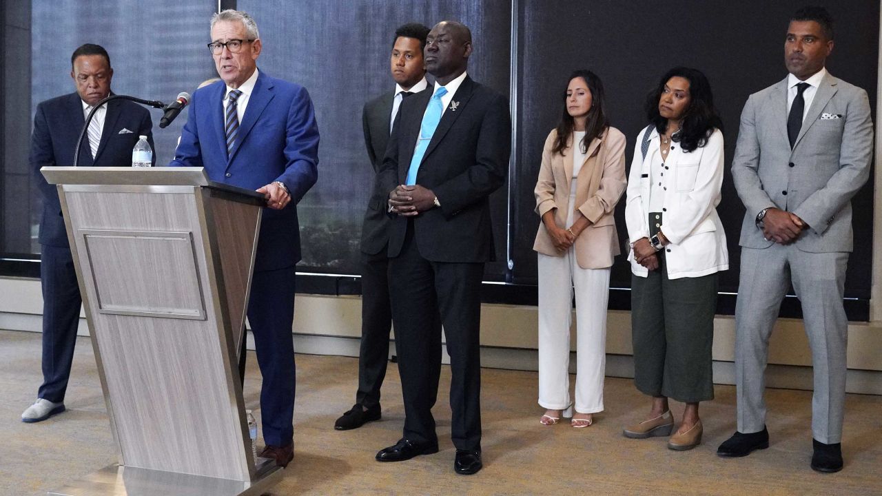 Attorney Steven Levin, second from left, speaks at a news conference in Chicago, Monday, July 24, 2023. The hazing scandal at Northwestern has widened to include a volleyball player who on Monday became the first female athlete to sue the university over allegations she was retaliated against for reporting mistreatment and a new lawsuit by former Northwestern quarterback Lloyd Yates. (AP Photo/Nam Y. Huh)