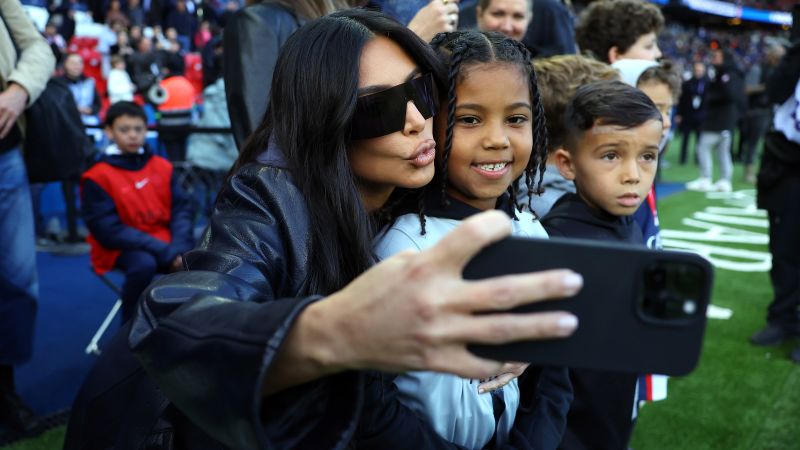 Kim Kardashian and ‘soccer obsessed’ son Saint are having time of their lives watching beautiful game on globetrotting tour