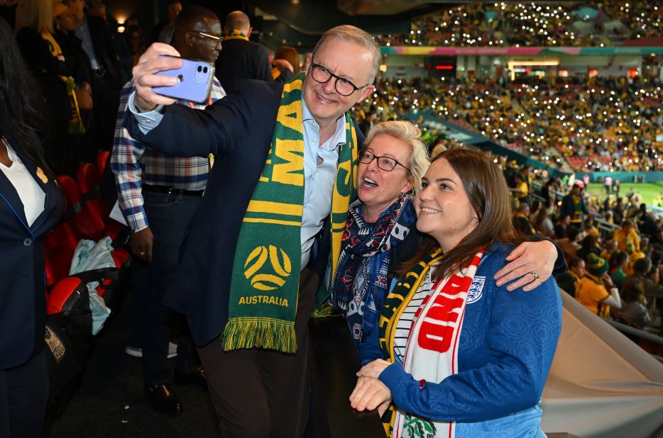 Australian Prime Minister Anthony Albanese takes a selfie with fans before the Nigeria match in Brisbane.