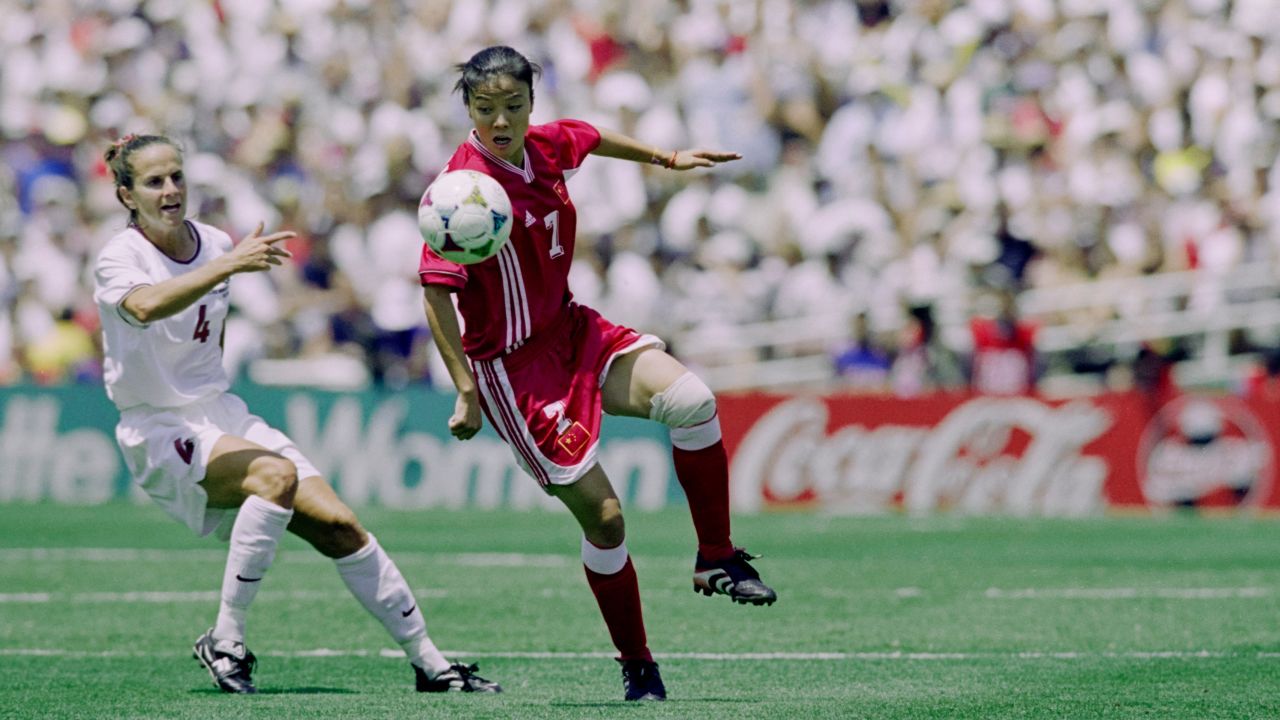 China's Zhang Ouying and Carla Overbeck for America compete during the final of the 1999 World Cup at the Rose Bowl in Pasadena, California.