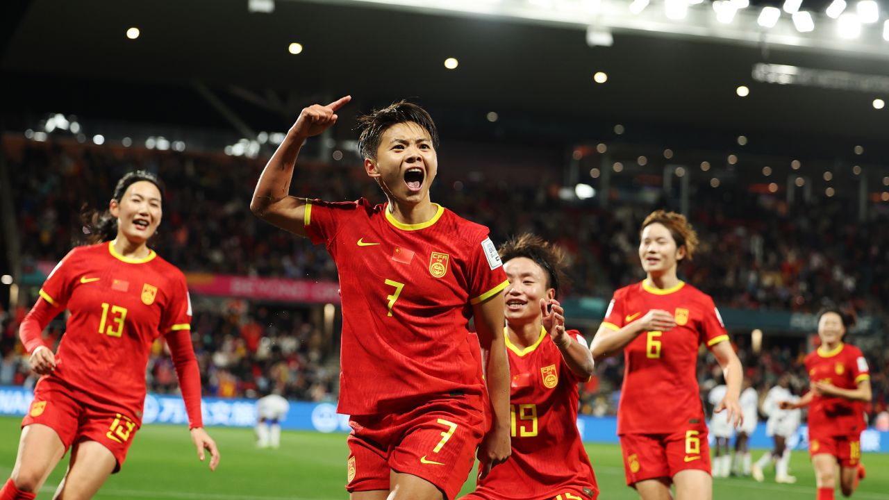 Wang Shuang celebrates with teammates after scoring for China against Haiti.