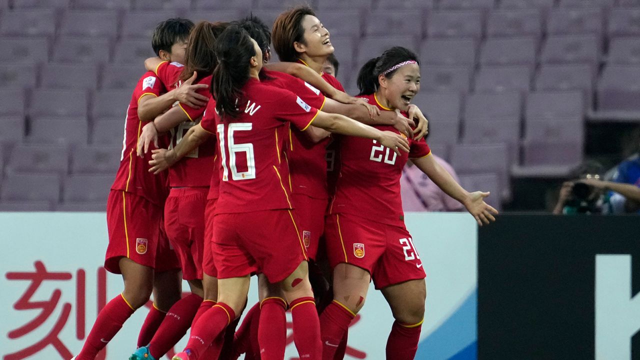 China's Xiao Yuyi, right celebrates after scoring a goal during the 2022 AFC final between China and South Korea in Mumbai, India.