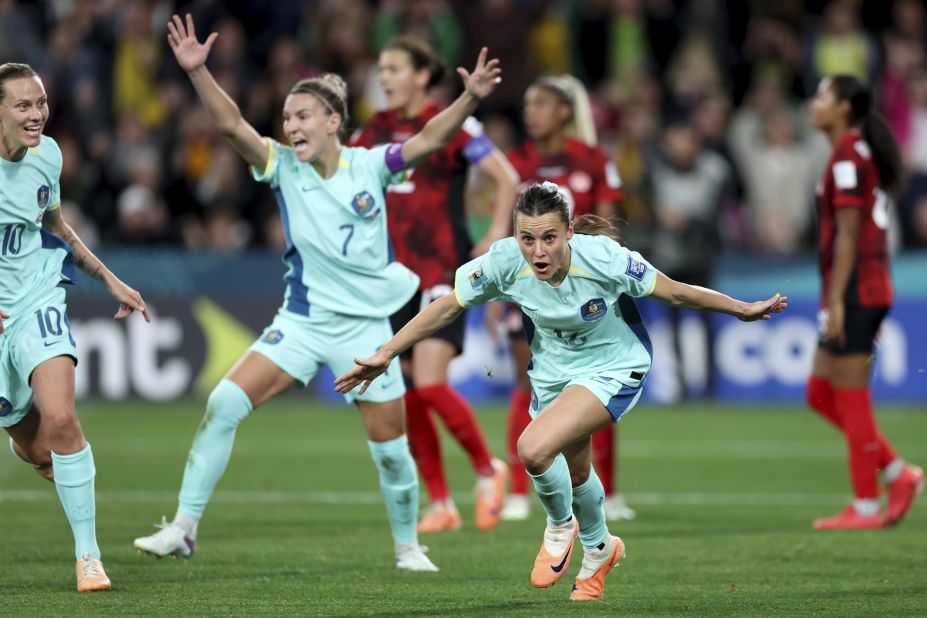 Australia's Hayley Raso, right, celebrates after scoring her side's second goal against Canada.