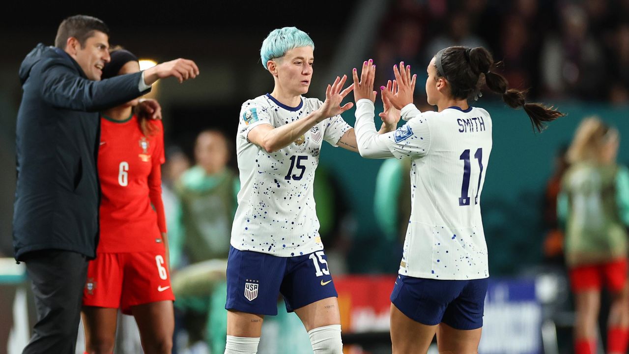 Sophia Smith (R) comes off to be replaced by  Rapinoe (L) during the match against Portugal.