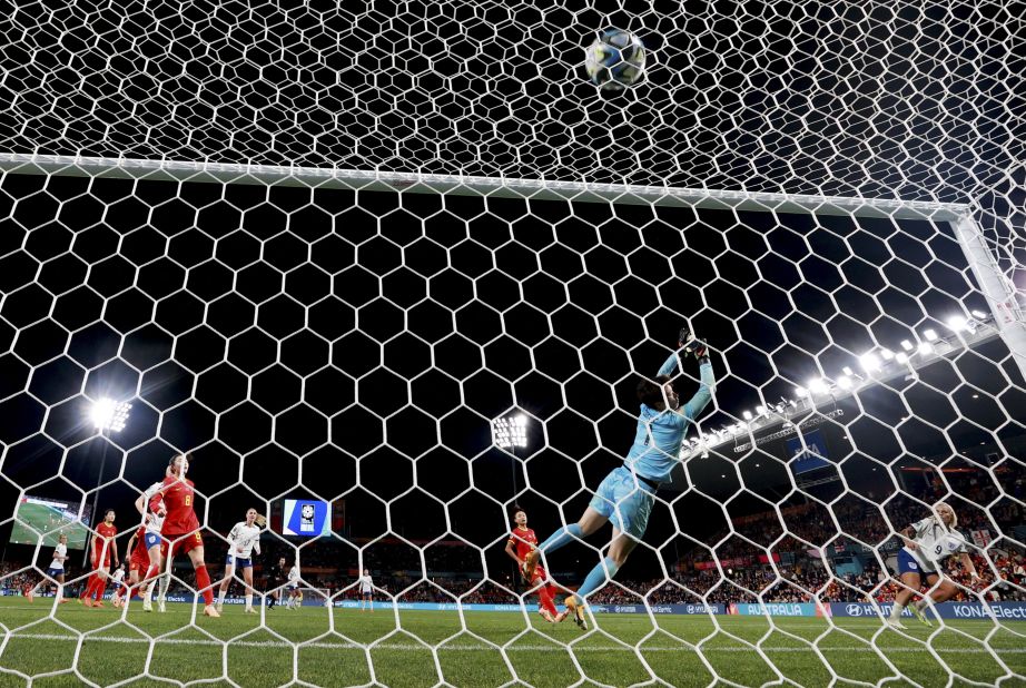 England's Rachel Daly, right, scores the sixth goal against China.