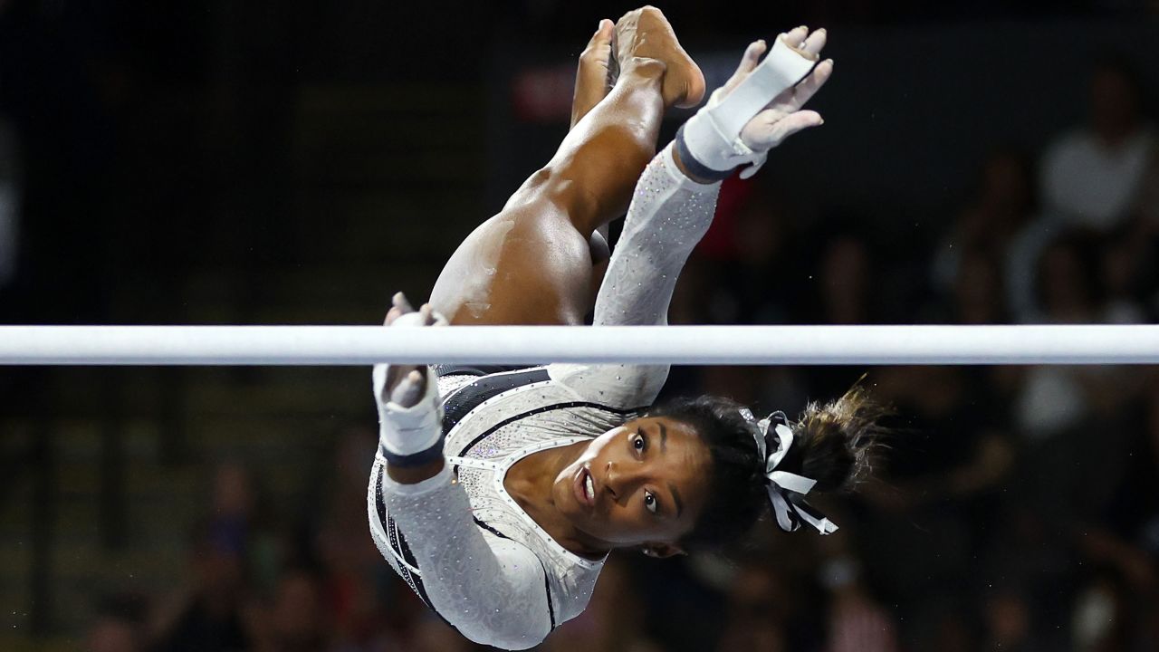 Simone Biles competes in the uneven bars during the Core Hydration Classic.