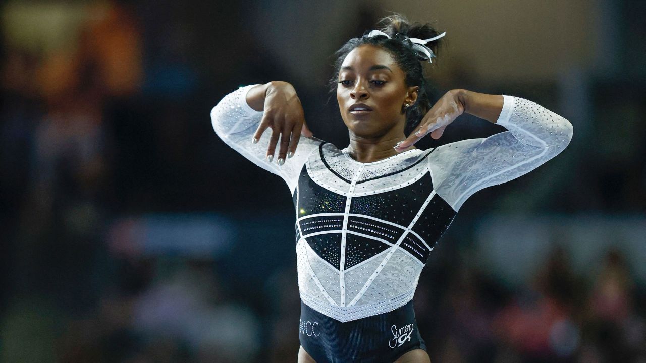 Simone Biles performs on the balance beam.