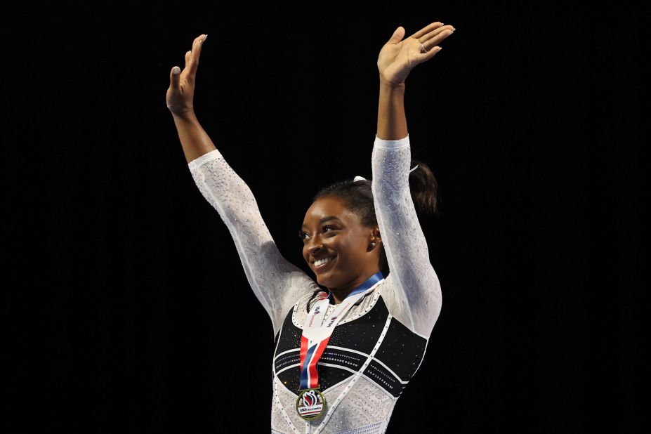 Biles reacts during the awards ceremony after <a href="https://www.cnn.com/2023/08/05/sport/simone-biles-gymnastics-return-spt-intl/index.html" target="_blank">claiming first place in the all-around of the Core Hydration Classic</a>.