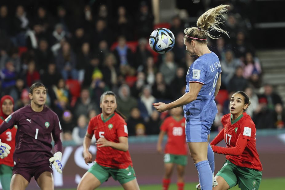 France's Eugénie Le Sommer heads the ball for her team's fourth goal — and her second of the match — against Morocco.