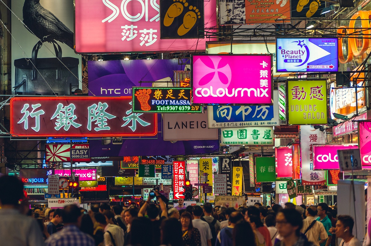 Neon signs on a street in Kowloon, Hong Kong, at night time.