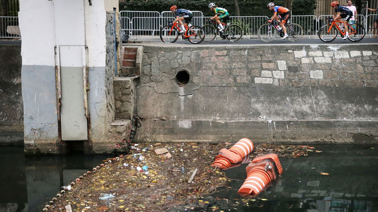 RIO DE JANEIRO, BRAZIL - AUGUST 07:  Competitors ride past an 'eco barrier' along a polluted canal in the Leblon neighborhood during the Women's Road Race on Day 2 of the Rio 2016 Olympic Games  on August 7, 2016 in Rio de Janeiro, Brazil. The Rio 2016 Olympic Games run until August 21.