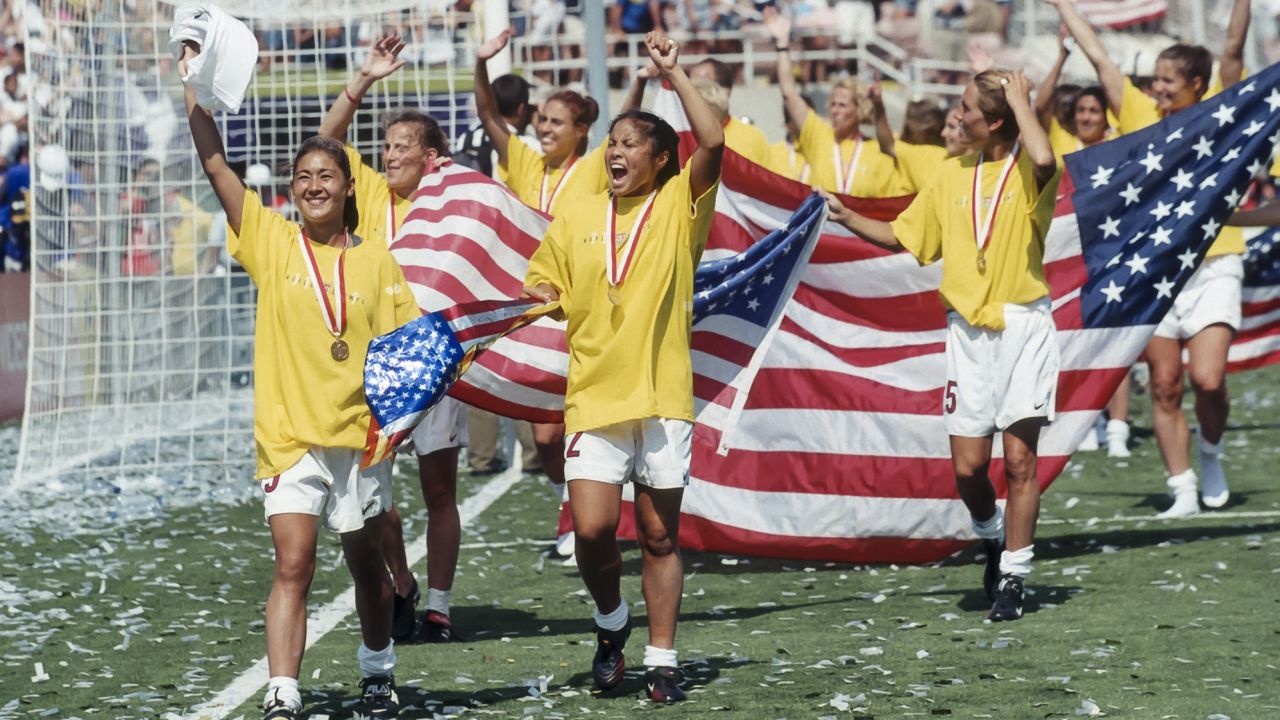 PASADENA, CA -  JULY 10:  Members of the USA Women's National Team celebrate winning the 1999 FIFA Women's World Cup following the final game played against China on July 10, 1999 at the Rose Bowl in Pasadena, California.  Visible players include Tiffany Roberts #5, Lorrie Fair #2, and Tisha Venturini #15.   (Photo by David Madison/Getty Images)