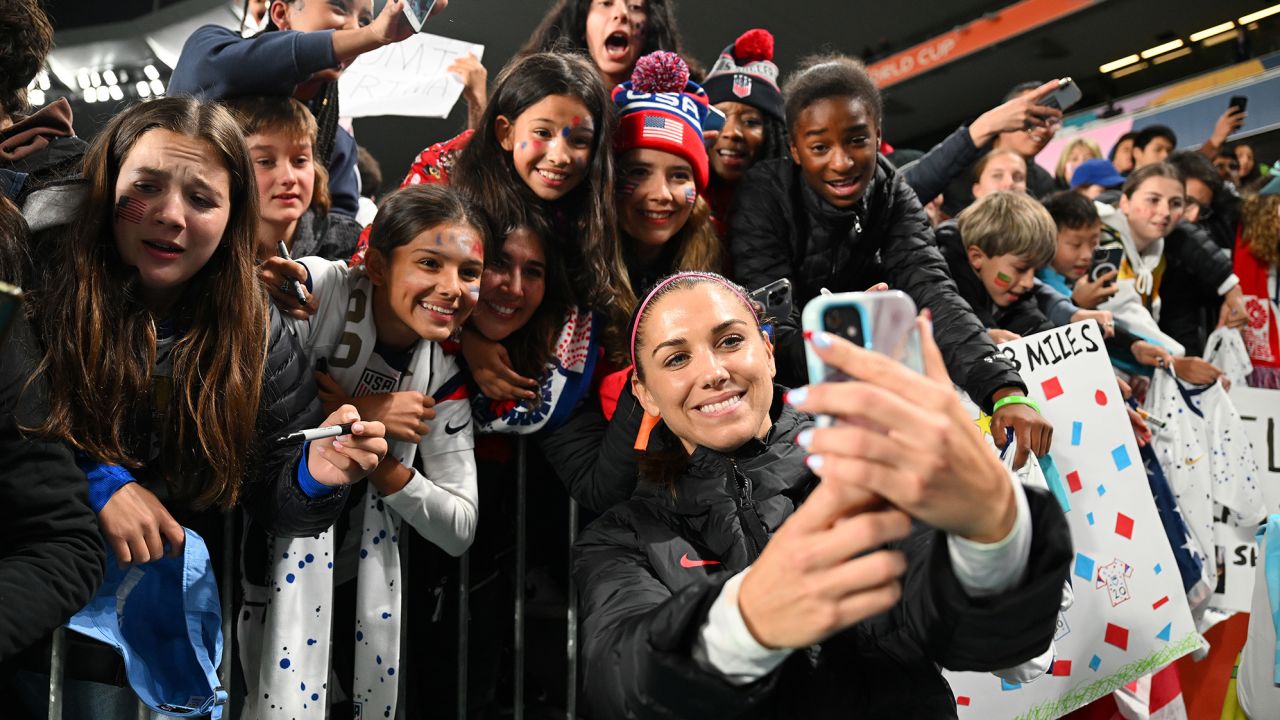 US forward Alex Morgan  takes a selfie with fans at Eden Park on August 1, 2023.