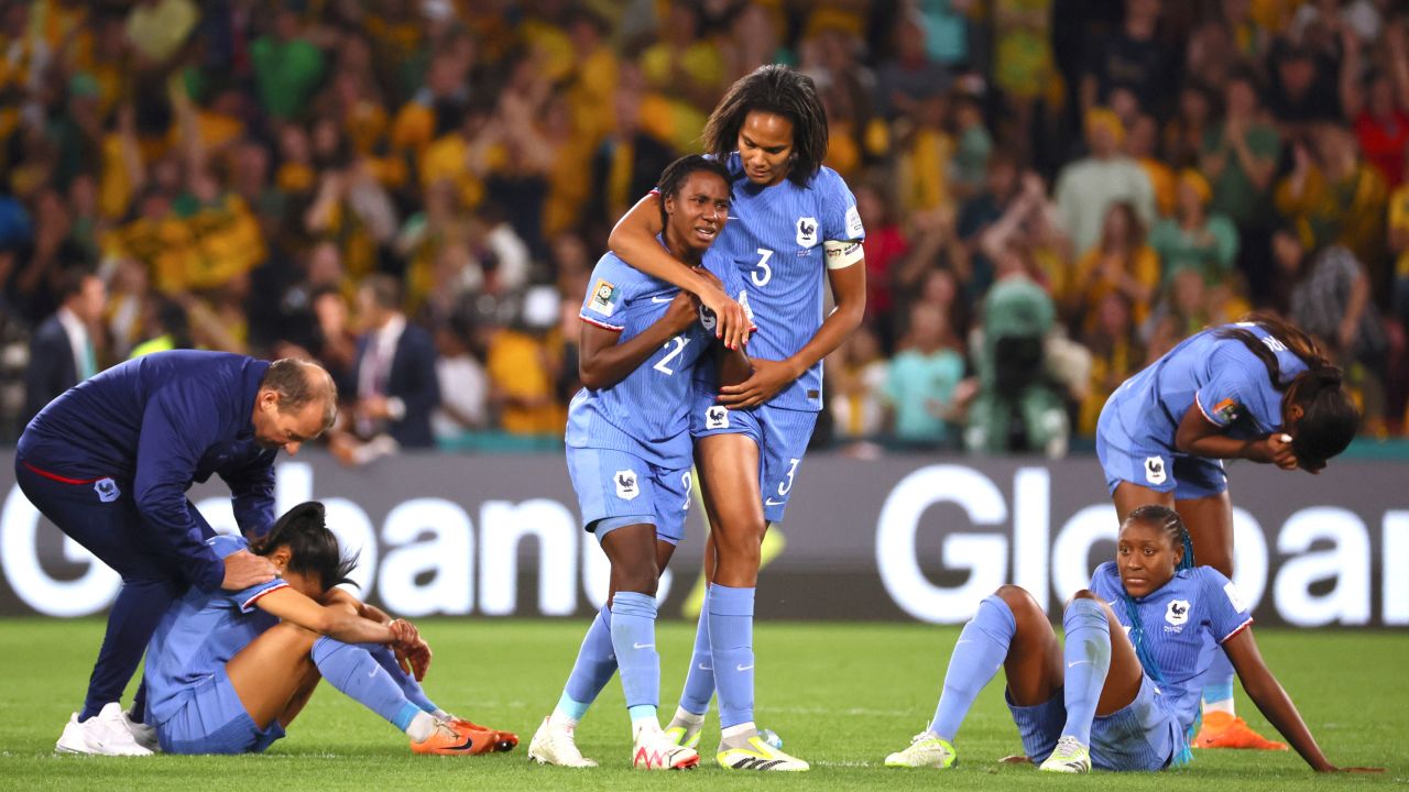 France players are dejected on the pitch.