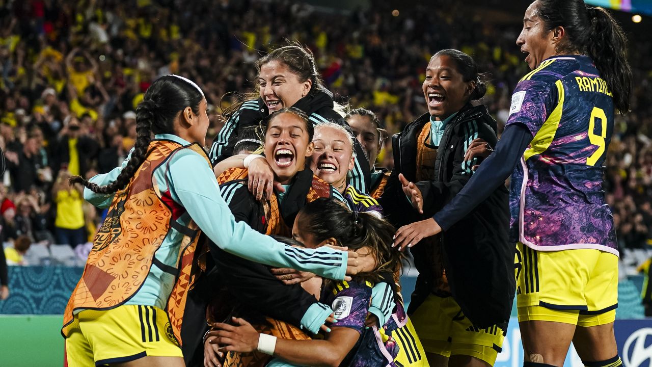 Leicy Santos celebrates with her teammates.