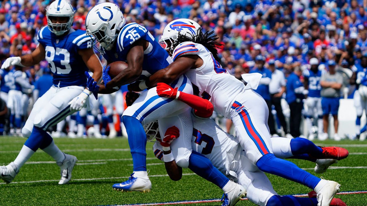 Aug 12, 2023; Orchard Park, New York, USA; Buffalo Bills safety Damar Hamlin (3) and linebacker Dorian Williams (42)  tackle Indianapolis Colts running back Deon Jackson (35) during the first half at Highmark Stadium. Mandatory Credit: Gregory Fisher-USA TODAY Sports