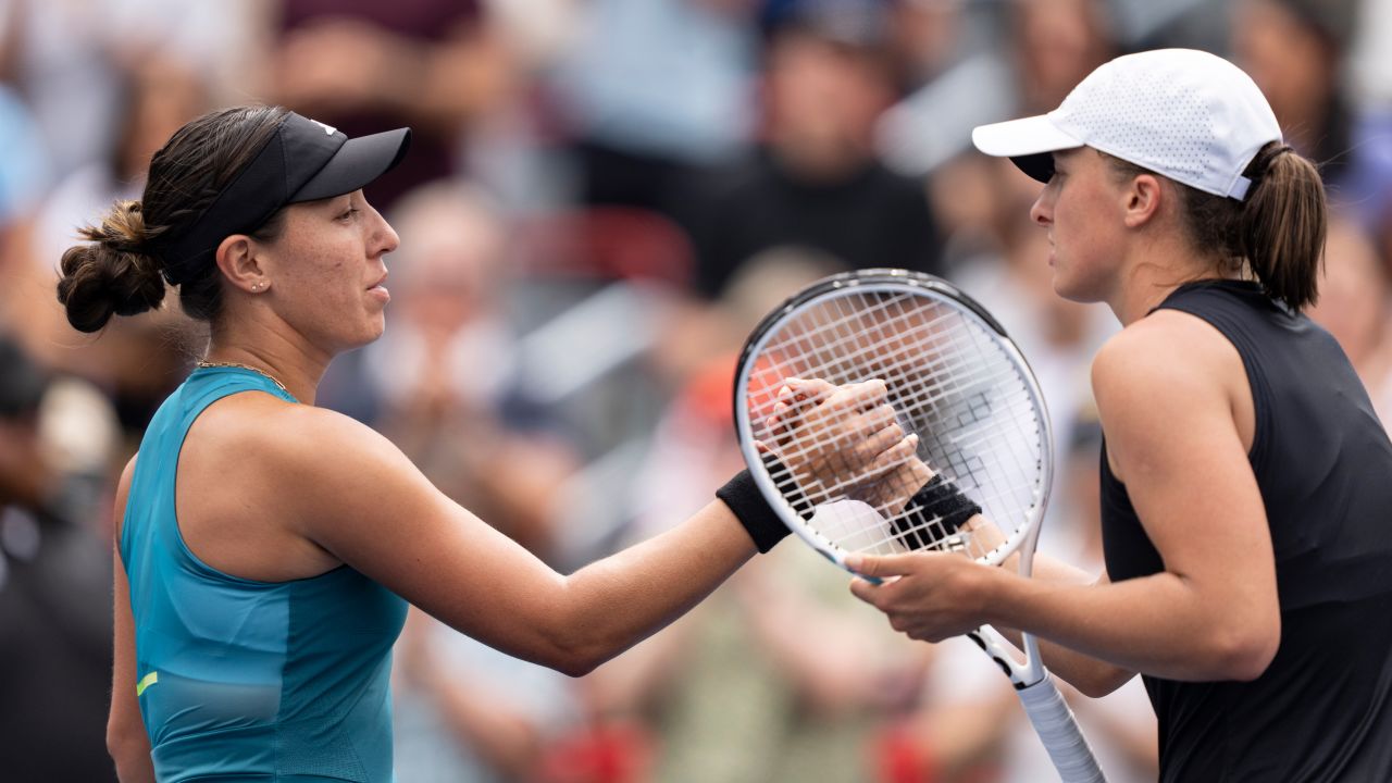 Jessica Pegula of the United States, left, shakes hands with Iga Swiatek of Poland, following the semifinals of the National Bank Open women's tennis tournament Saturday, Aug. 12, 2023, in Montreal.