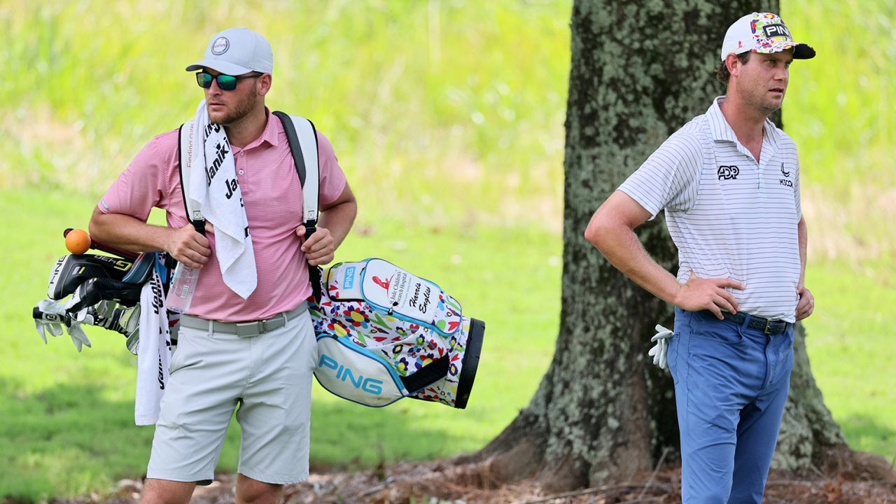 MEMPHIS, TENNESSEE - AUGUST 11: A replacement caddie carries the bag for Harris English of the United States after his caddie had to drop out for the day during the second round of the FedEx St. Jude Championship at TPC Southwind on August 11, 2023 in Memphis, Tennessee. (Photo by Andy Lyons/Getty Images)