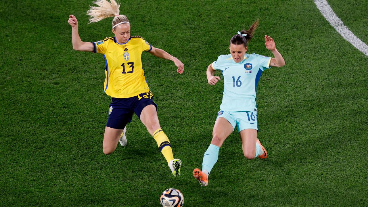 Sweden's Amanda Ilestedt fights for the ball with Australia's Hayley Raso.