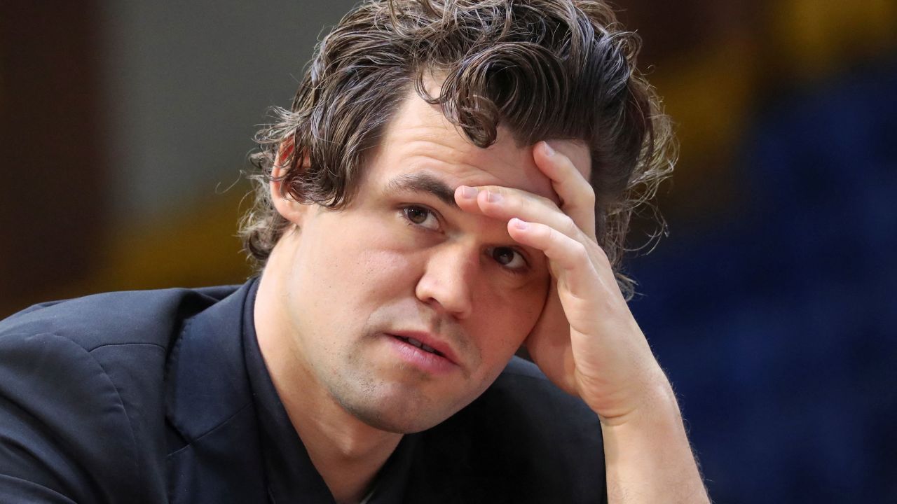 Chess - FIDE World Rapid and Blitz Championships 2022 - Blitz Open - Almaty, Kazakhstan - December 30, 2022. Magnus Carlsen of Norway sits in front of a chess board during a game. REUTERS/Pavel Mikheyev