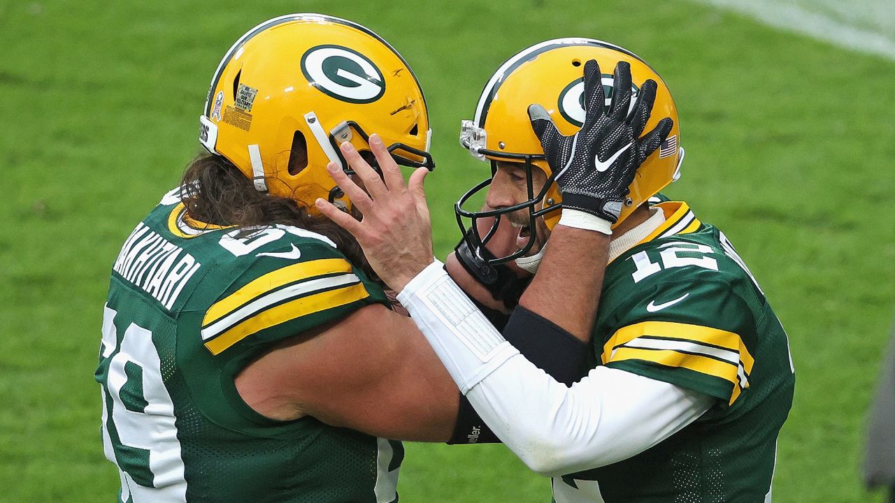 GREEN BAY, WISCONSIN - NOVEMBER 15: Aaron Rodgers #12 of the Green Bay Packers celebrates a touchdown run with David Bakhtiari #69 in the 2nd quarter against the Jacksonville Jaguars
 at Lambeau Field on November 15, 2020 in Green Bay, Wisconsin. (Photo by Dylan Buell/Getty Images)