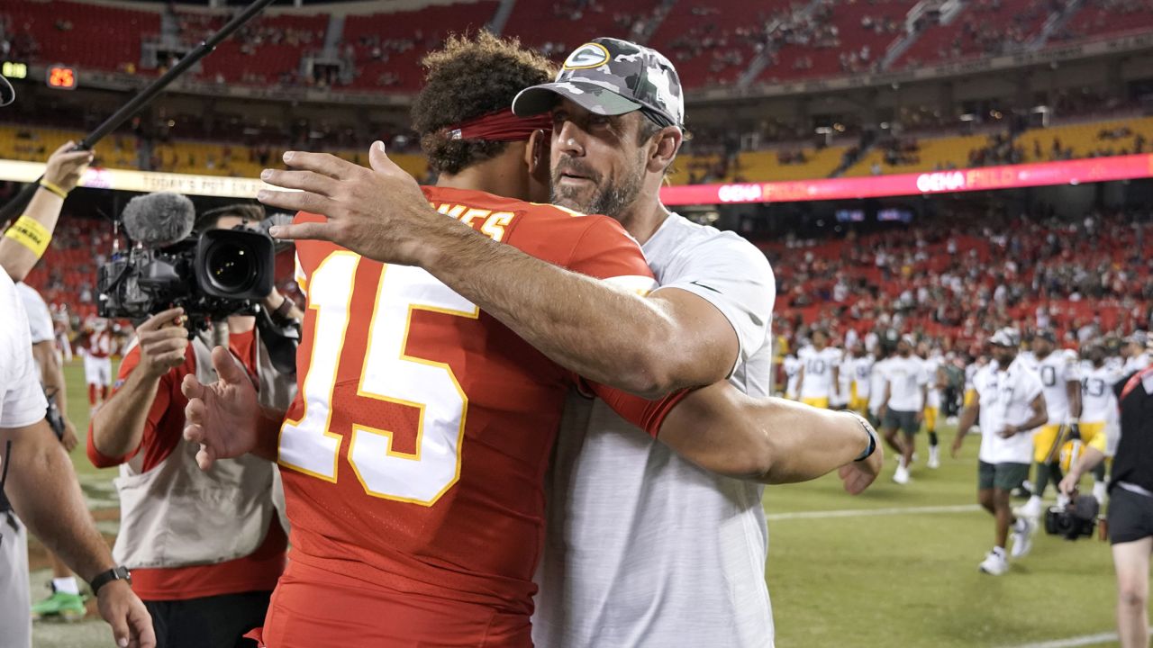 Kansas City Chiefs quarterback Patrick Mahomes (15) hugs Green Bay Packers quarterback Aaron Rodgers following of an NFL preseason football game Thursday, Aug. 25, 2022, in Kansas City, Mo. (AP Photo/Ed Zurga)