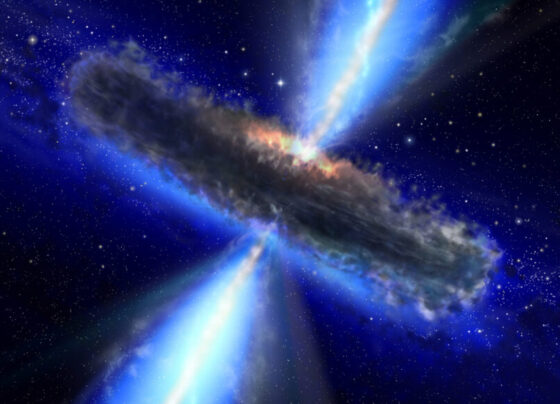 In this illustration of a supermassive black hole, rays of bright gas escape from the center of a disc-shaped gray cloud.