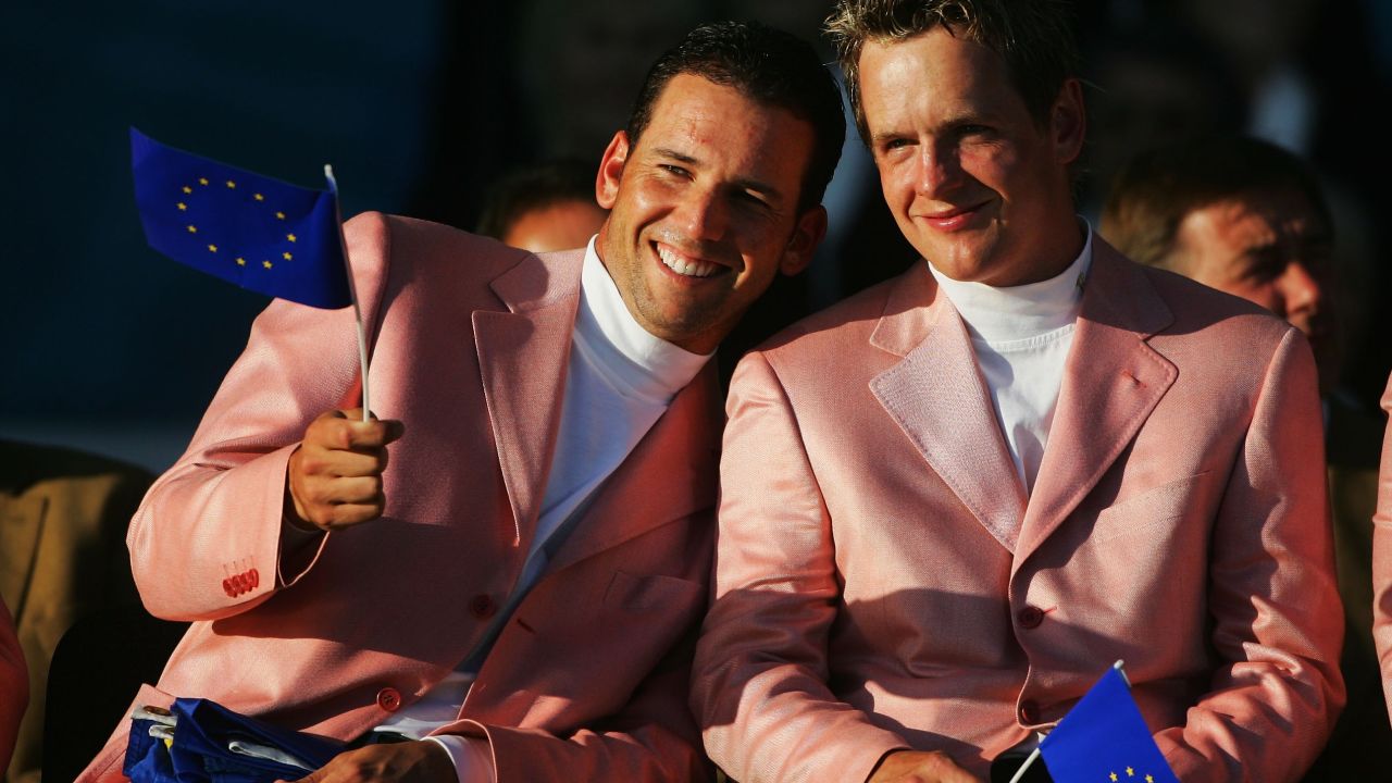 Sergio Garcia (L) and Luke Donald wave European flags at 2006 closing ceremony