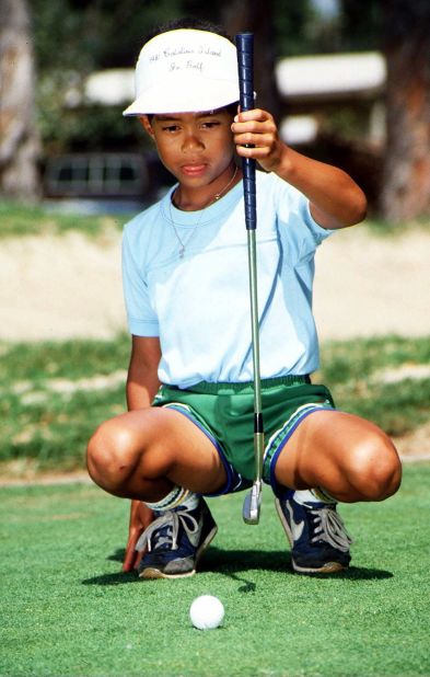 Woods, 6, sizes up a putt in Los Alamitos, California, in 1982. His real name is Eldrick, but his father nicknamed him "Tiger" after a South Vietnamese soldier he fought alongside with during the Vietnam War.