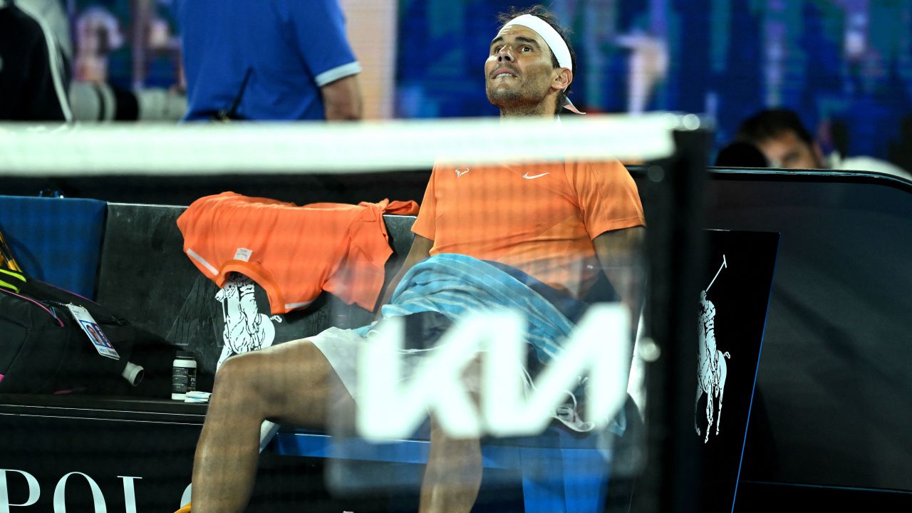 Spain's Rafael Nadal takes rest during the break in his men's singles match against  Mackenzie McDonald of the US on day three of the Australian Open tennis tournament in Melbourne on January 18, 2023. - -- IMAGE RESTRICTED TO EDITORIAL USE - STRICTLY NO COMMERCIAL USE -- (Photo by MANAN VATSYAYANA / AFP) / -- IMAGE RESTRICTED TO EDITORIAL USE - STRICTLY NO COMMERCIAL USE -- (Photo by MANAN VATSYAYANA/AFP via Getty Images)