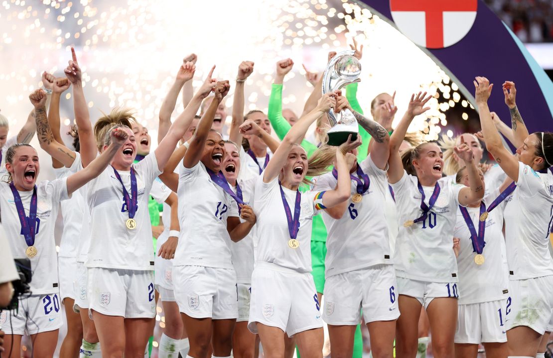 LONDON, ENGLAND - JULY 31: Leah Williamson and Millie Bright of England lift the trophy after their teams victory during the UEFA Women's Euro 2022 final match between England and Germany at Wembley Stadium on July 31, 2022 in London, England. (Photo by Naomi Baker/Getty Images)